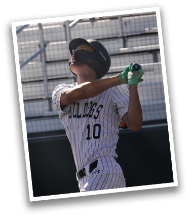 A baseball player in a black and white uniform is swinging a bat on a baseball field. Contenido generado con IA