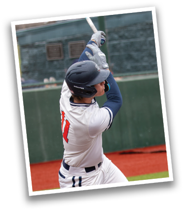 A baseball player is swinging a bat at a ball. Contenido generado con IA