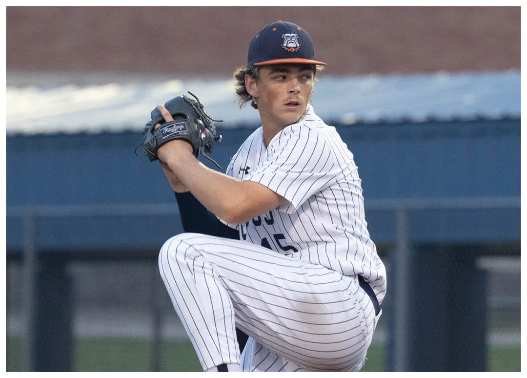 A baseball player in a blue and white uniform is pitching a ball on a field. Contenido generado con IA