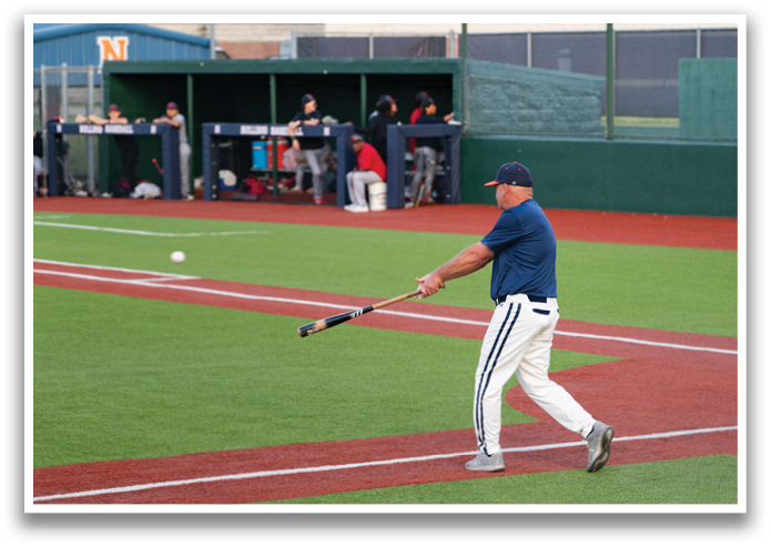 A baseball player is swinging a bat on a field. Contenido generado con IA