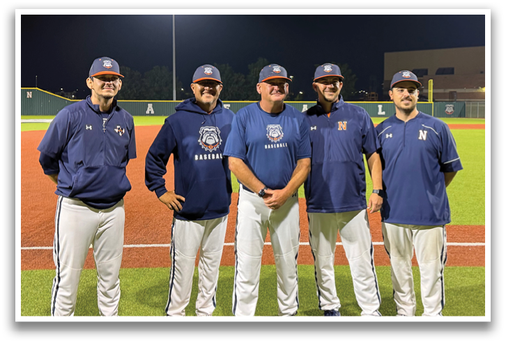 Five men in baseball uniforms pose for a picture on a baseball field. Contenido generado con IA