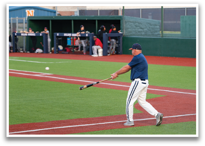 A baseball player is swinging a bat on a field. Contenido generado con IA