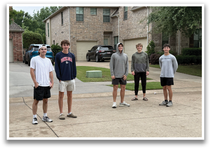 Five young men standing in a driveway, posing for a picture. Contenido generado con IA