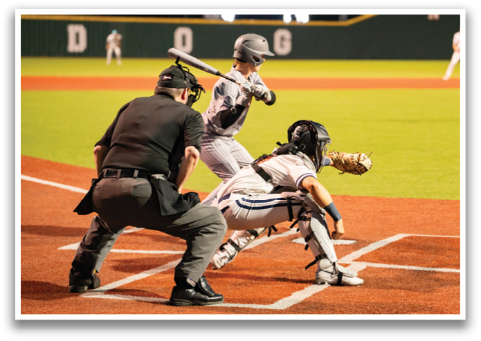 A baseball player is swinging a bat at a ball during a game. Contenido generado con IA