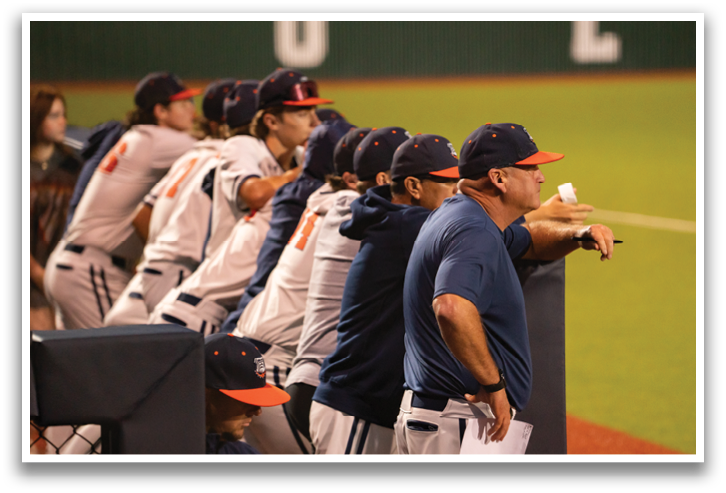 Baseball players in uniforms are lined up on the field, watching the game. Contenido generado con IA