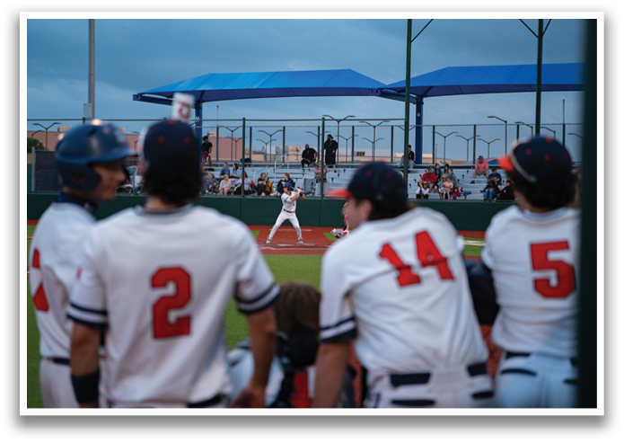 A baseball game is in progress with a player at bat. Contenido generado con IA