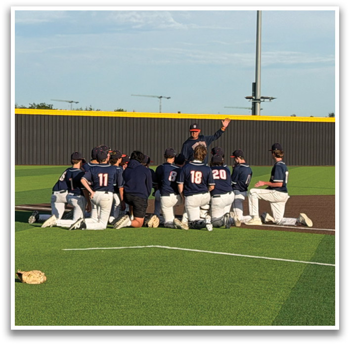 A group of baseball players are standing on a field, some of them are wearing blue shirts. Contenido generado con IA