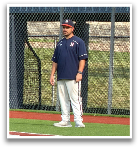 Two men are standing on a baseball field, one of them is a coach. Contenido generado con IA