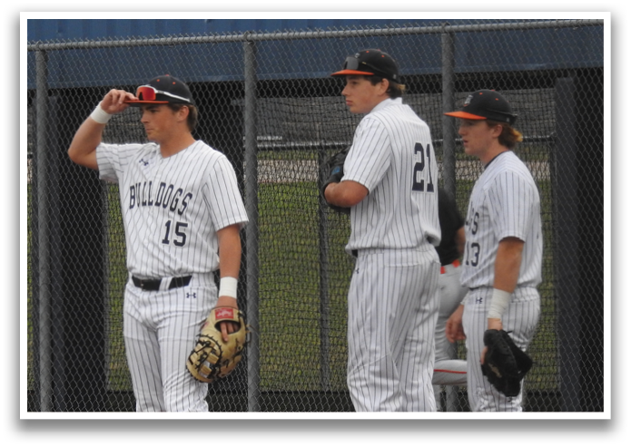 Three baseball players wearing uniforms and holding gloves are standing on a field. Contenido generado con IA