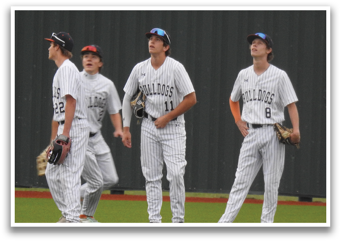Four baseball players wearing uniforms and holding gloves. Contenido generado con IA