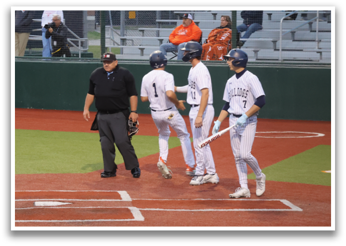 A baseball player is swinging a bat at a ball, while a catcher and an umpire watch closely. Contenido generado con IA