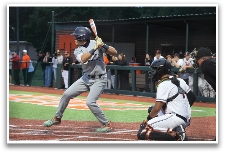 A baseball player is swinging a bat at a ball during a game. Contenido generado con IA
