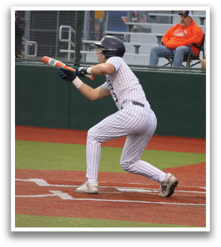 Baseball players are standing on a field, some of them wearing helmets. A man is sitting on a bench, watching the players. Contenido generado con IA