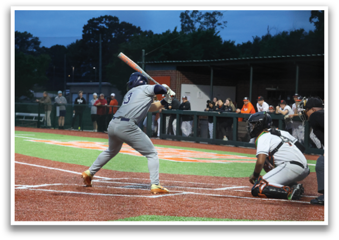 A baseball player is swinging a bat at a ball during a game. Contenido generado con IA