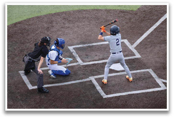A baseball player is swinging a bat, attempting to hit a ball. Contenido generado con IA