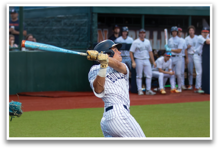 A baseball player is swinging a bat at a ball during a game. Contenido generado con IA