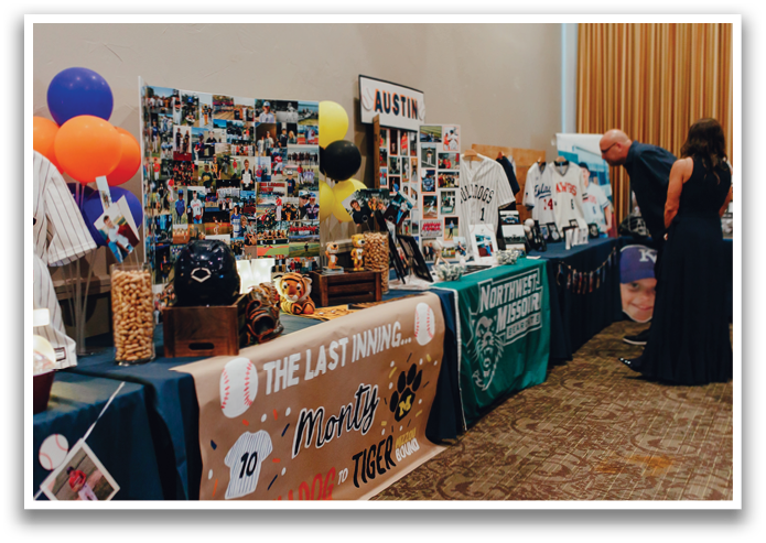 A man and woman are looking at a table with a baseball jersey on it. Contenido generado con IA