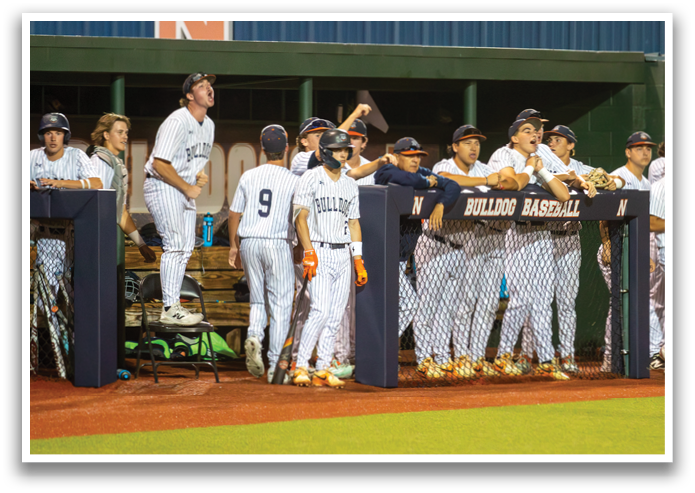 Baseball players in uniforms are standing on a field, some of them holding baseball bats. Contenido generado con IA