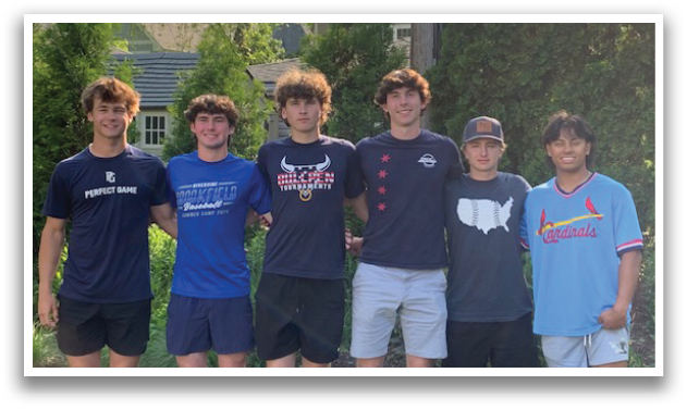 A group of young men pose for a picture in front of a house. AI generated content