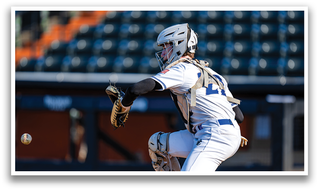 A baseball player in a catcher's position, wearing a helmet and white uniform, is ready to catch a ball. AI generated content