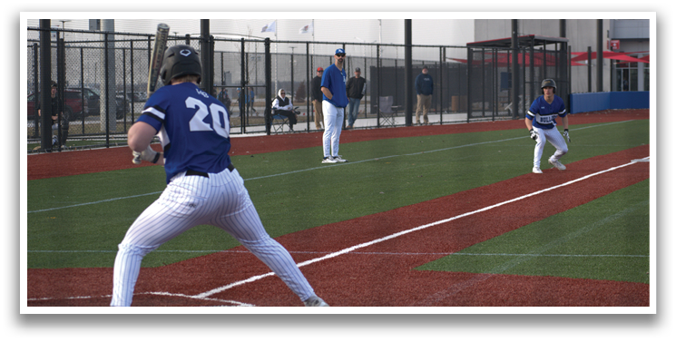 A baseball player in a blue uniform is swinging a bat on a field. AI generated content