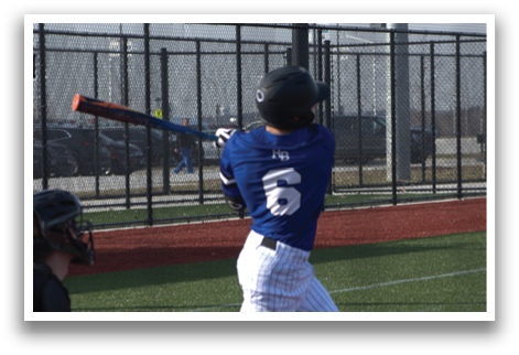 A baseball player in a blue shirt and white pants is swinging a bat on a field. AI generated content