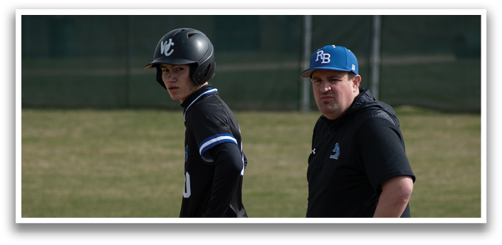 Two men are standing on a baseball field, one of them wearing a baseball helmet. AI generated content