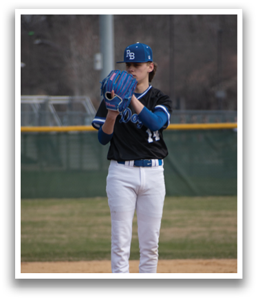 A baseball player in a black and blue uniform is standing on the pitcher's mound, holding a baseball in his glove. AI generated content