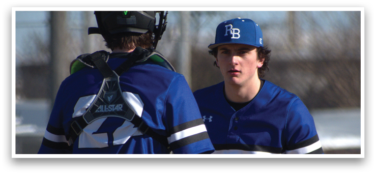 Two baseball players wearing blue and white uniforms are standing on a field. One player is holding a baseball glove. AI generated content
