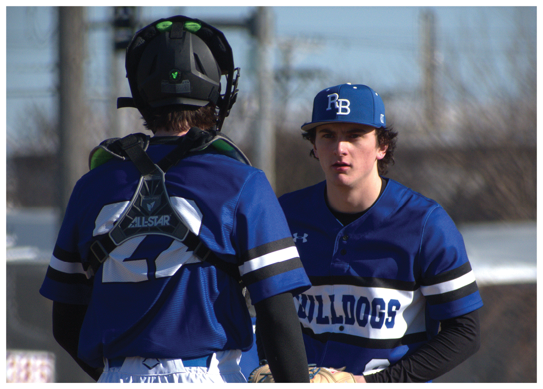 Two baseball players wearing blue and white uniforms are standing on a field. One player is holding a baseball glove. AI generated content