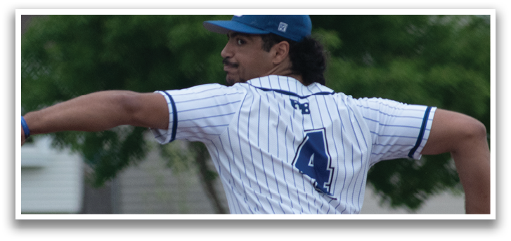 A baseball player wearing a blue and white uniform is pitching a ball. Description generated by AI