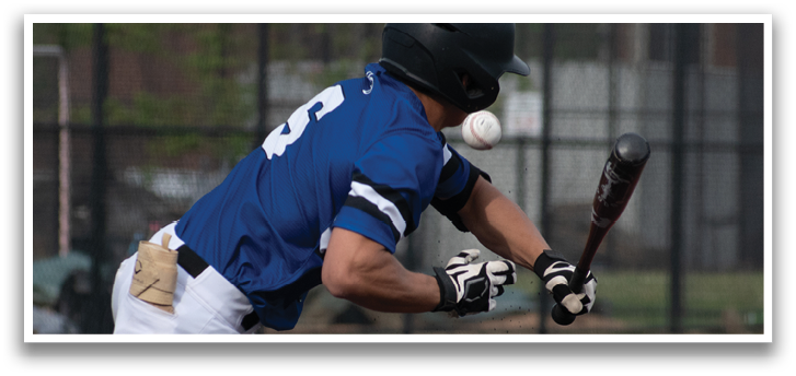 A baseball player is swinging a bat at a ball. Description generated by AI