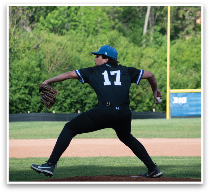 A baseball player wearing a black shirt and blue hat is pitching a ball. Description generated by AI