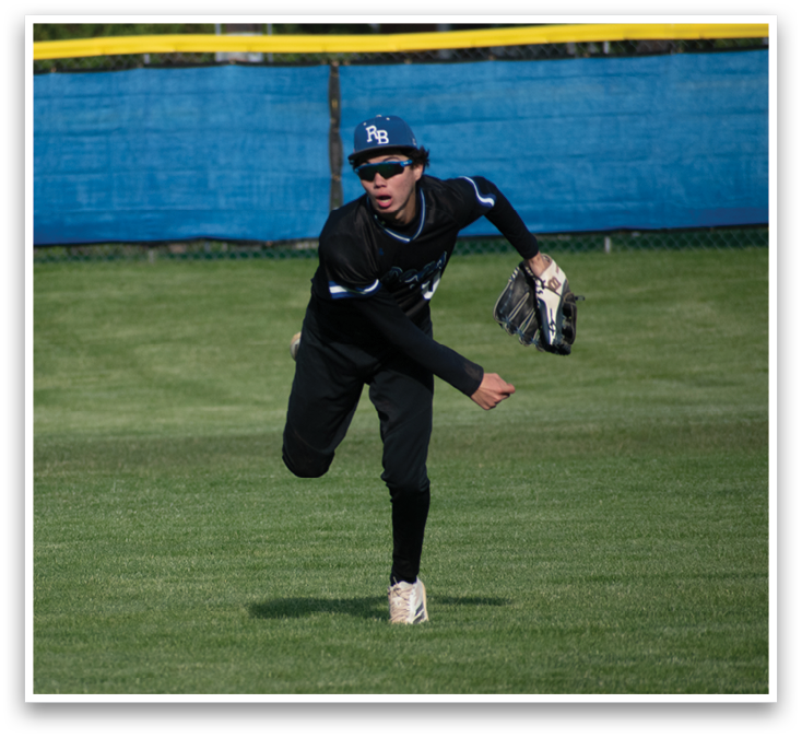 A baseball player in a black and white uniform is running on the field. Description generated by AI