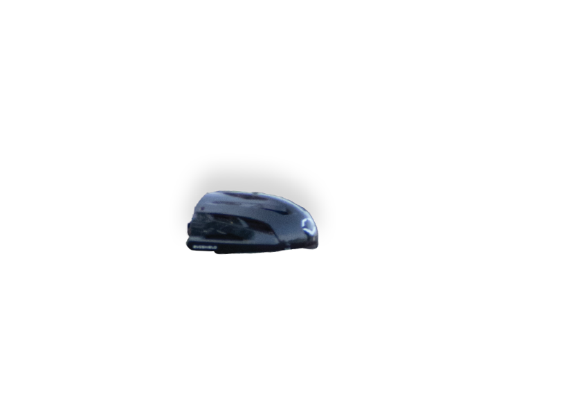 A small car is parked in a parking lot. Description generated by AI