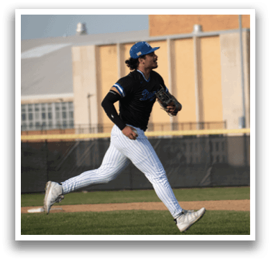 A man running on a baseball field. Description generated by AI