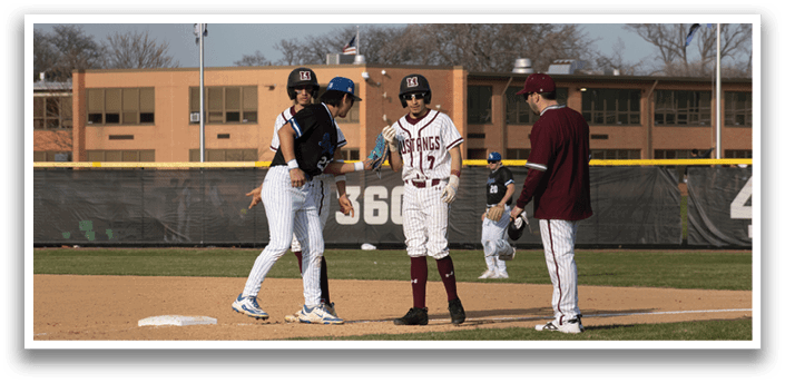 A baseball game is taking place on a field. Description generated by AI