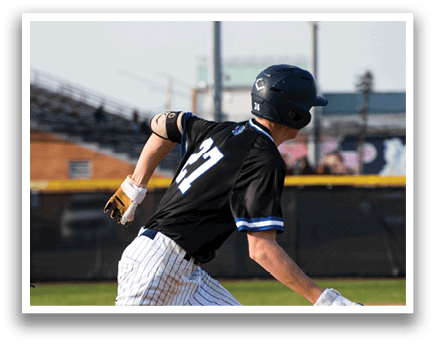 A baseball player running to first base. Description generated by AI