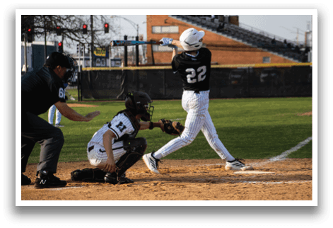 A baseball player is swinging a bat at a ball. Description generated by AI