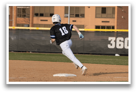 A baseball player is running to first base. Description generated by AI