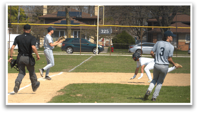 A baseball player slides into home plate. Description generated by AI