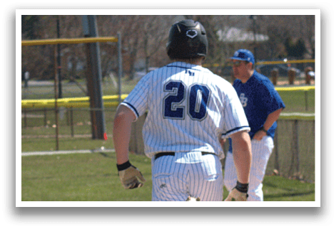 A baseball player running to the base. Description generated by AI