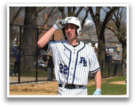 A baseball player wearing a white and blue uniform with the number 22 on the back. Description generated by AI