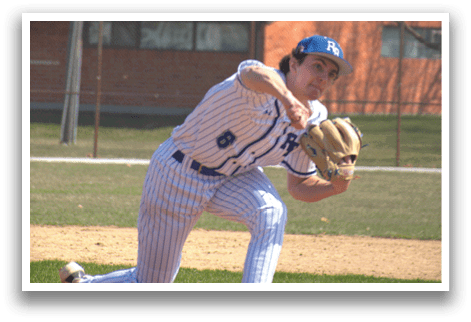 A baseball player in a blue and white uniform is pitching a ball. Description generated by AI