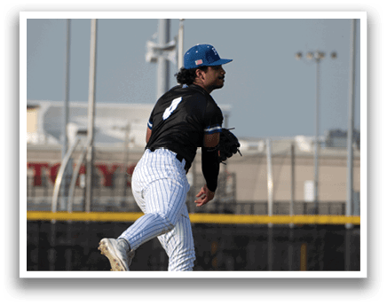 A baseball player in a black and white uniform is pitching a ball. Description generated by AI