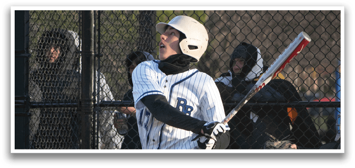 A baseball player in a white uniform is swinging a bat. Description generated by AI