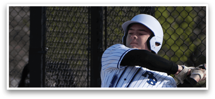 A baseball player in a white and black uniform is swinging a bat. Description generated by AI