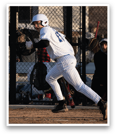A baseball player in a white uniform is running to first base. Description generated by AI