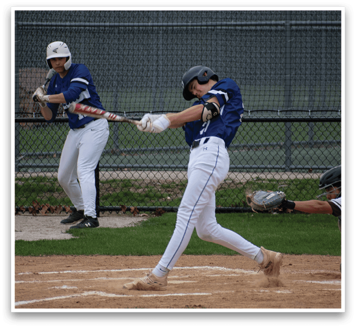 A baseball player is swinging a bat at a ball. Description generated by AI