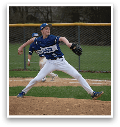 A baseball player in a blue and white uniform is pitching a ball. Description generated by AI